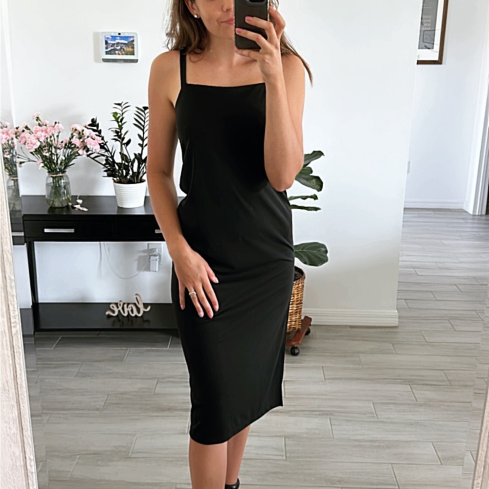 XSmall H&M black slip midi dress. Cut slit and calf length. Barely used.